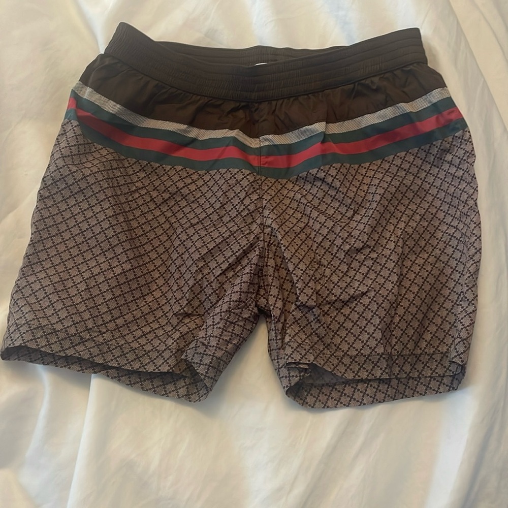 My son has grown out of this Gucci swimsuit!  Absolute stunner.